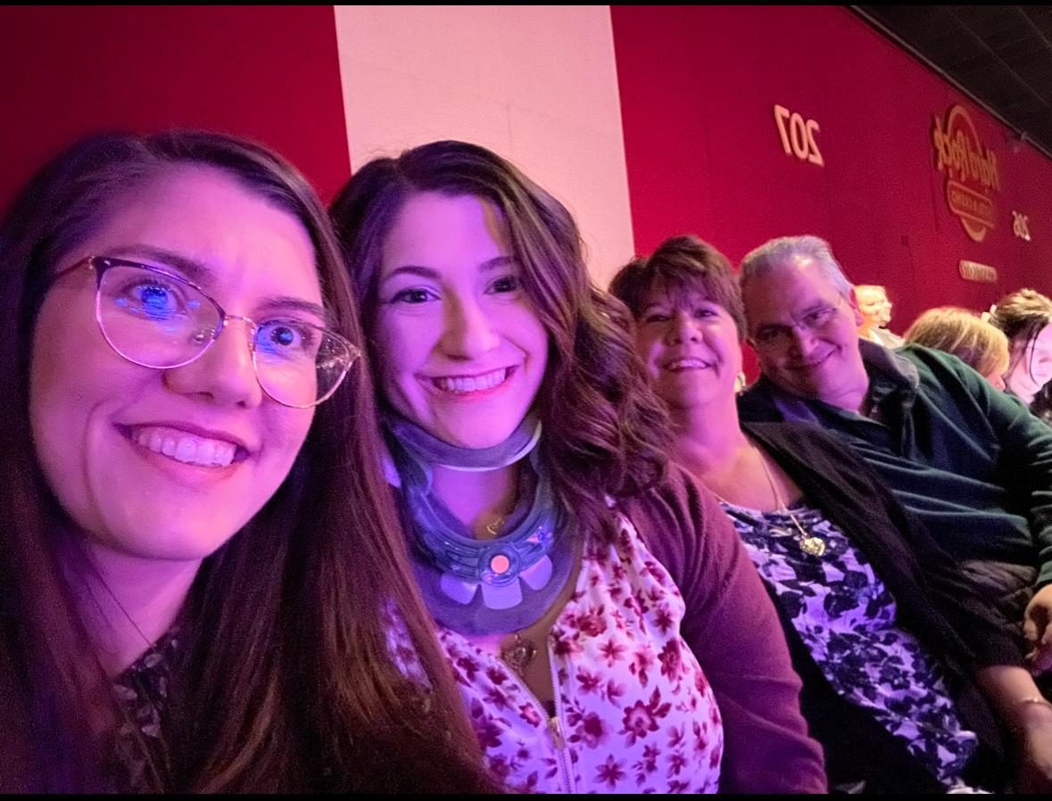 Val with family at a celebration