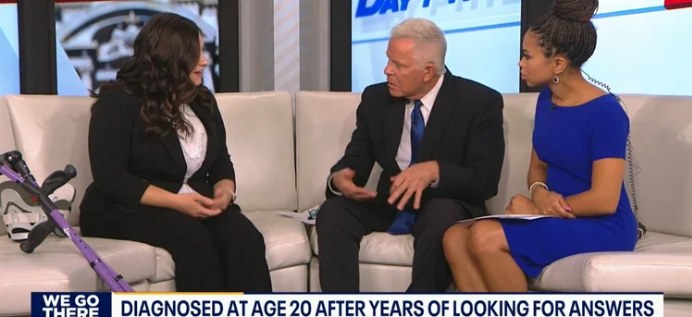 Val being interviewed on the FOX 29 Good Day Philadelphia couch, with her forearm crutch beside her