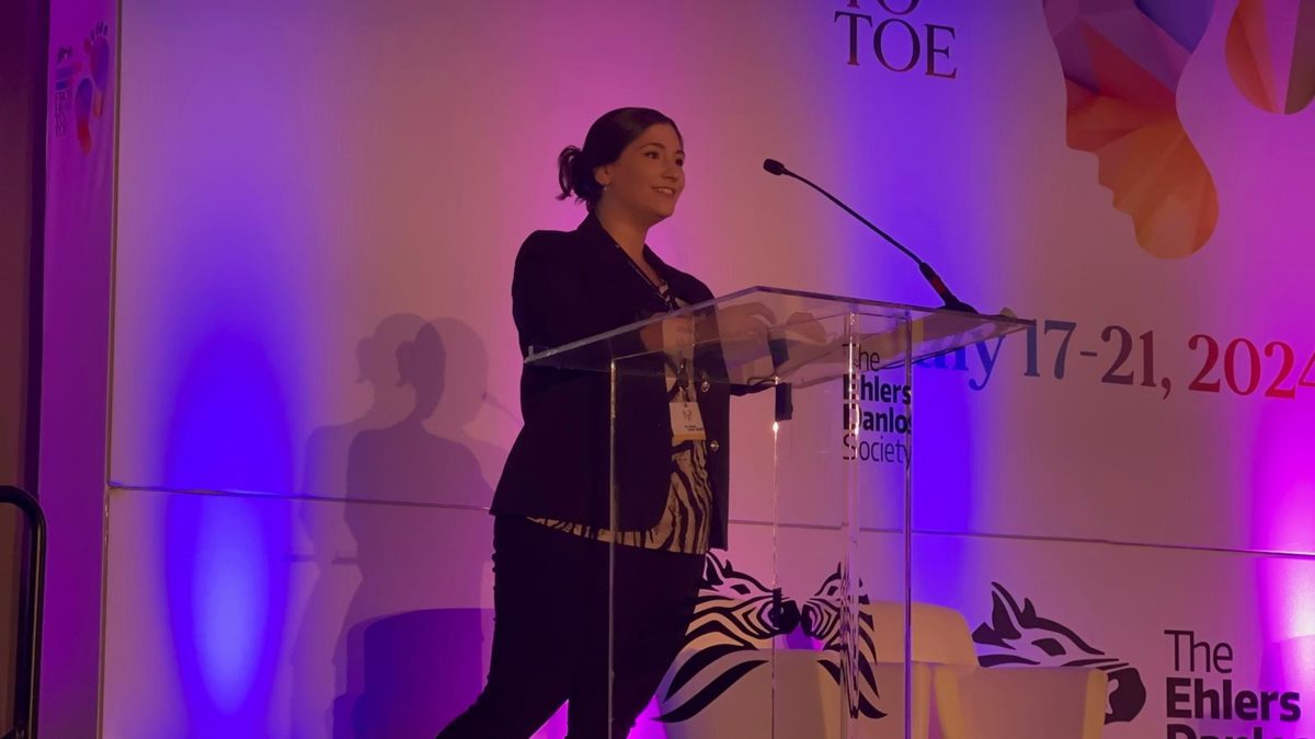 Val presenting at a podium at the 2024 Global Learning Conference